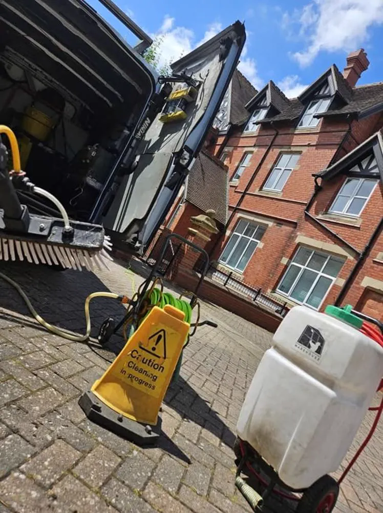 SkyVac gutter vacuum clearing moss and leaves from a Telford roofline
