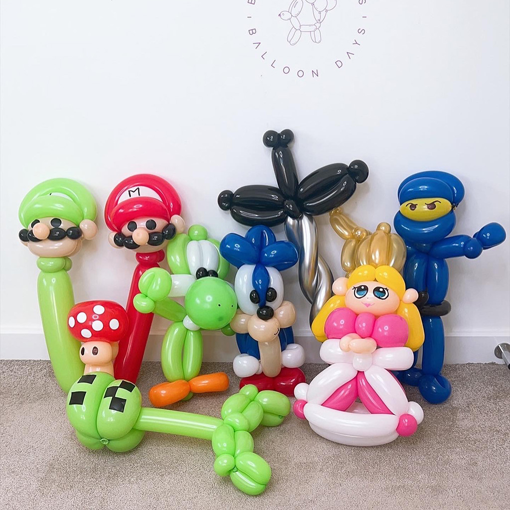 A group of twisted character balloon sculptures including video game and cartoon favourites