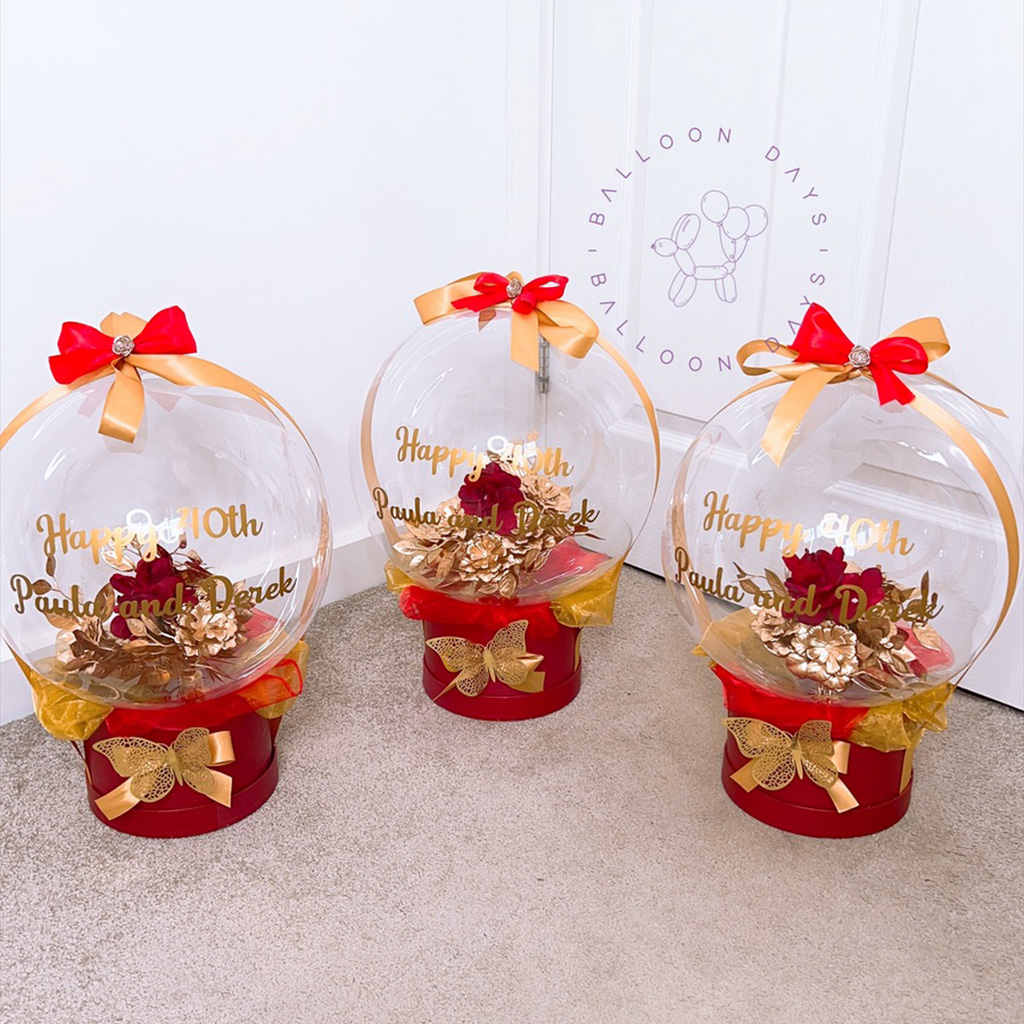 Red and gold personalised bubble balloon gift baskets for an anniversary