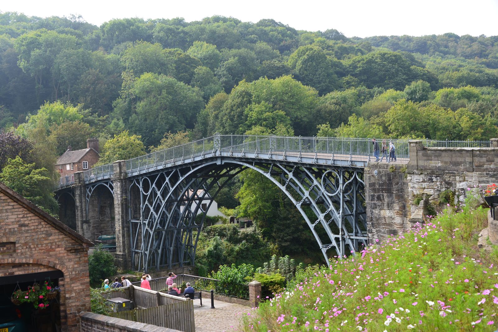 The Iron Bridge by day, its cast-iron ribs spanning the River Severn between the gorge's wooded slopes