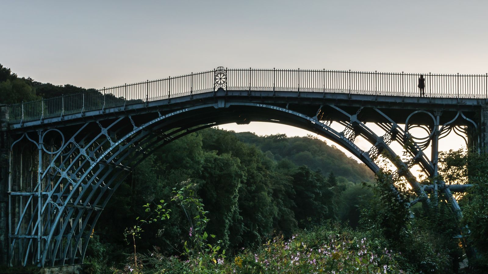 The Iron Bridge, the world's first major cast-iron bridge, arching over the wooded Severn gorge at dusk
