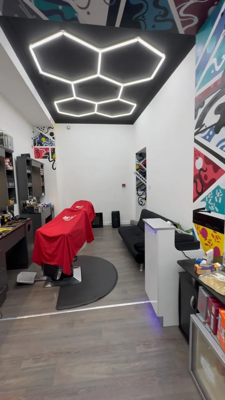 Inside the GoodLyf shop with hexagon lighting and a graffiti wall