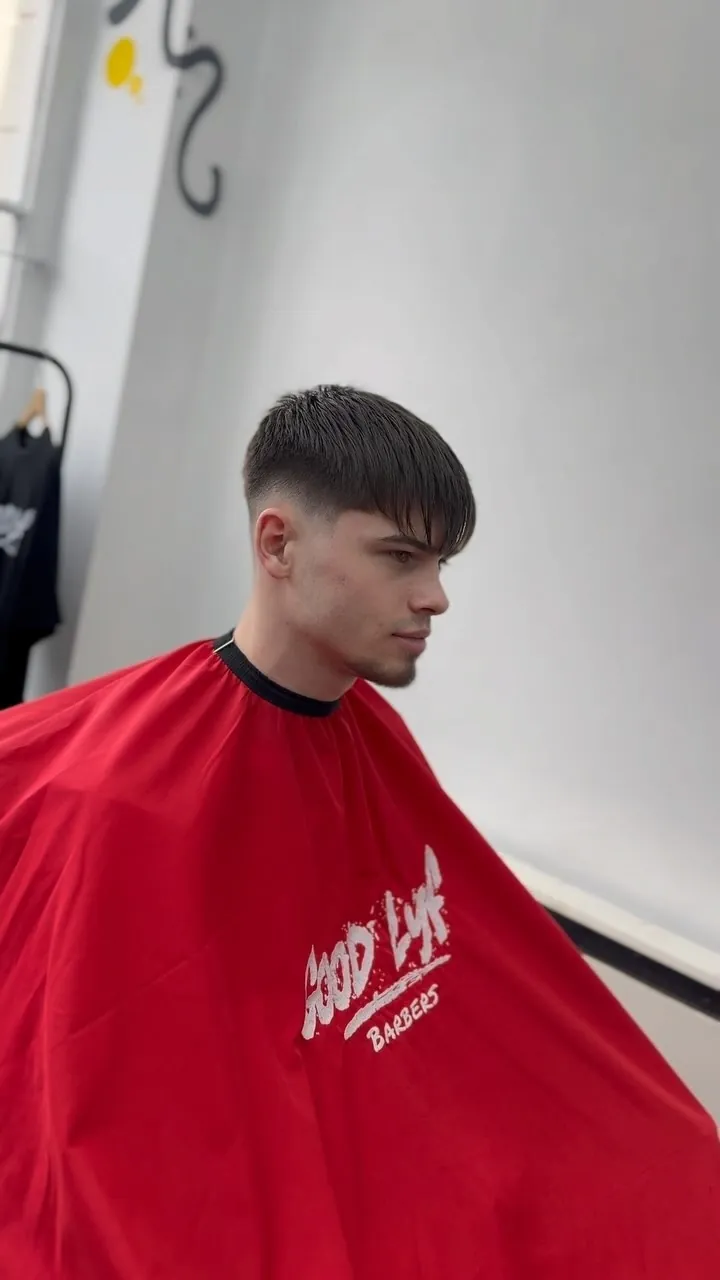 A styled cut with the graffiti wall behind
