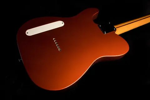 The lower bout of the copper Cabronita, body contour against black