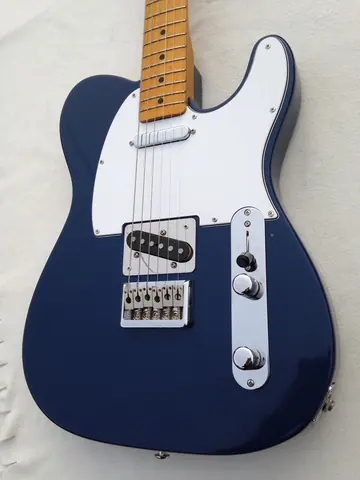 The dark blue J. Davey Standard Series Telecaster seen from the lower bout, showing the bridge and control plate