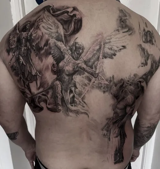 Angels in black and grey across the upper back
