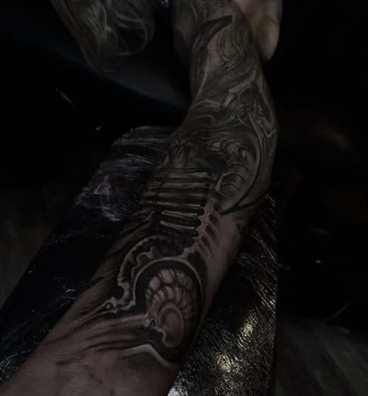 Biomechanical black and grey forearm piece