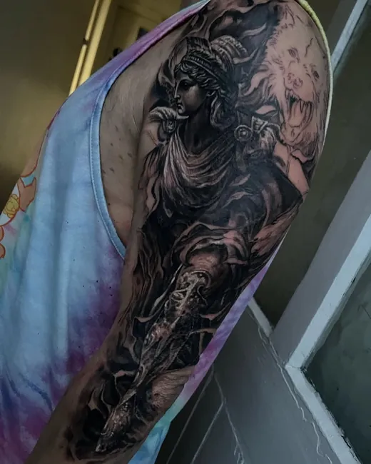 Dark figure scene in black and grey, freshly wrapped on the upper arm