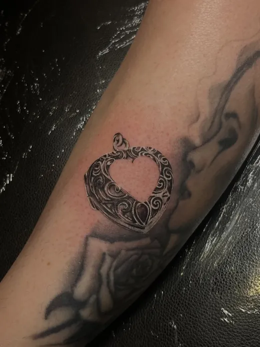 Ornate keepsake wrapped in smoke, black and grey