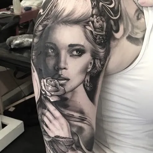 Black and grey portrait of a woman with a rose