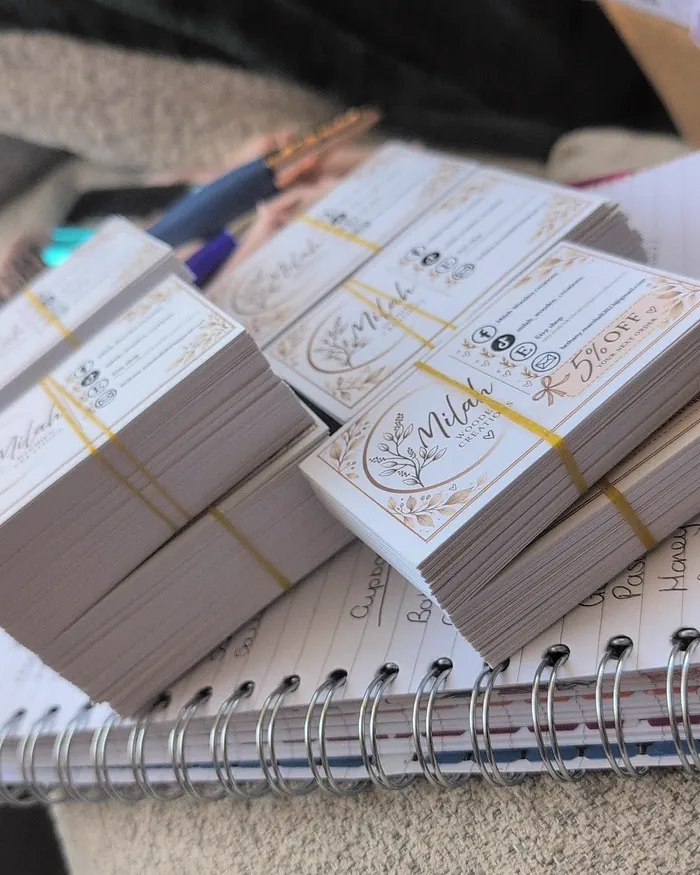 Stacks of Milah Wooden Creations cards bundled with yellow elastic bands, ready to go into orders.