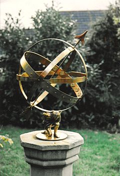 An Atlas Apollo, the brass Apollo armillary supported by the Atlas figurine.