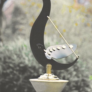 The Cygnus sundial, a swan in black-stoved aluminium with brass gnomon and Roman numerals set along its outstretched wings.