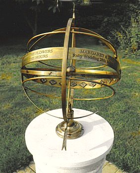 A close view of an Ecliptic armillary carrying a personal inscription engraved along the equatorial band.