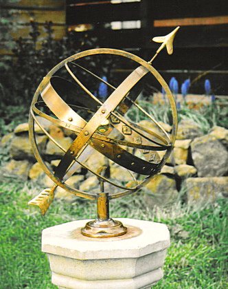 An Ecliptic armillary in brass that has been given a weathered antique appearance.