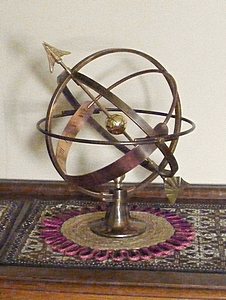 The Vesta armillary sphere in brass and copper bronze, a ten inch sphere on a small base.