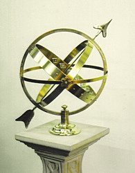 An all-brass Mandala armillary standing on display in the showroom.