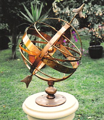 The all-bronze Orbis armillary sphere, its equatorial band carrying fitted Roman numerals.