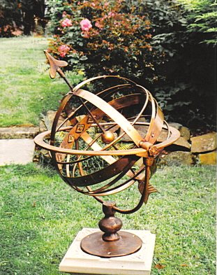 The all-bronze Taurus armillary, its pivoting globe held between two Taurean horns.