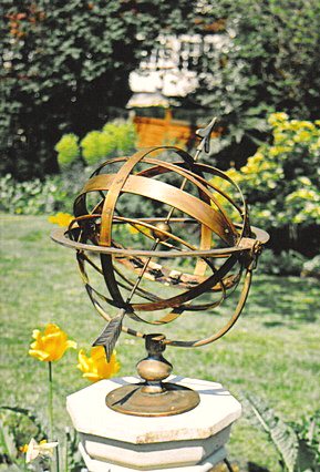 A Taurus armillary as installed in a garden.