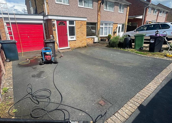 Block-paved driveway deep-cleaned and re-sanded, before