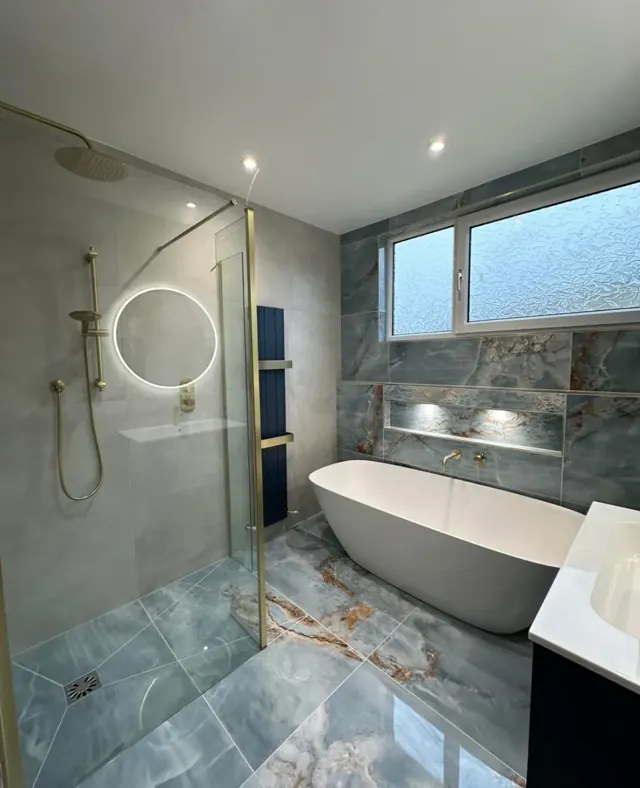 Grey bathroom, freestanding bath by Telford Plumbers