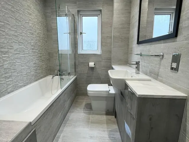 Bathroom with bath and shower by Telford Plumbers
