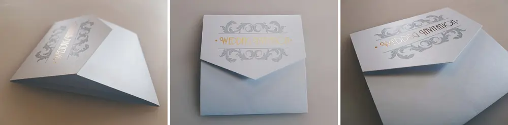 Three views of a folded pearl white wedding invitation sleeve, printed with a silver scroll border and the words Wedding Invitation in gold foil, shown open, closed and at an angle.