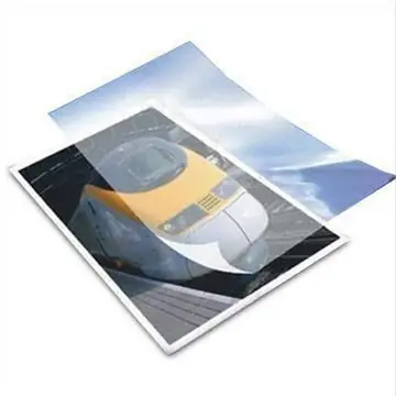 A laminated A4 brochure cover with a gloss finish catching the light.