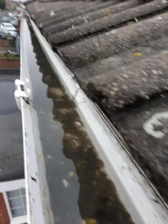 Working the channel clear, photographed from the pole camera on a Telford gutter