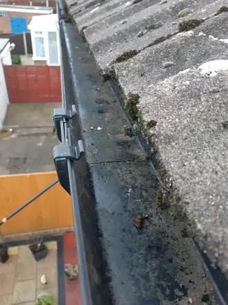 Black silt down the whole run, photographed from the pole camera on a Telford gutter
