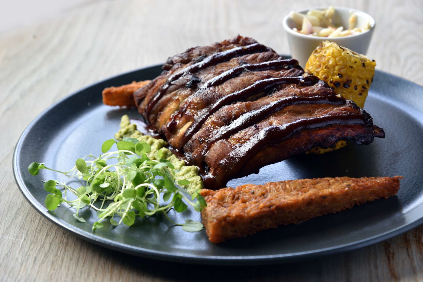 A plate of ribs and hand-cut chips