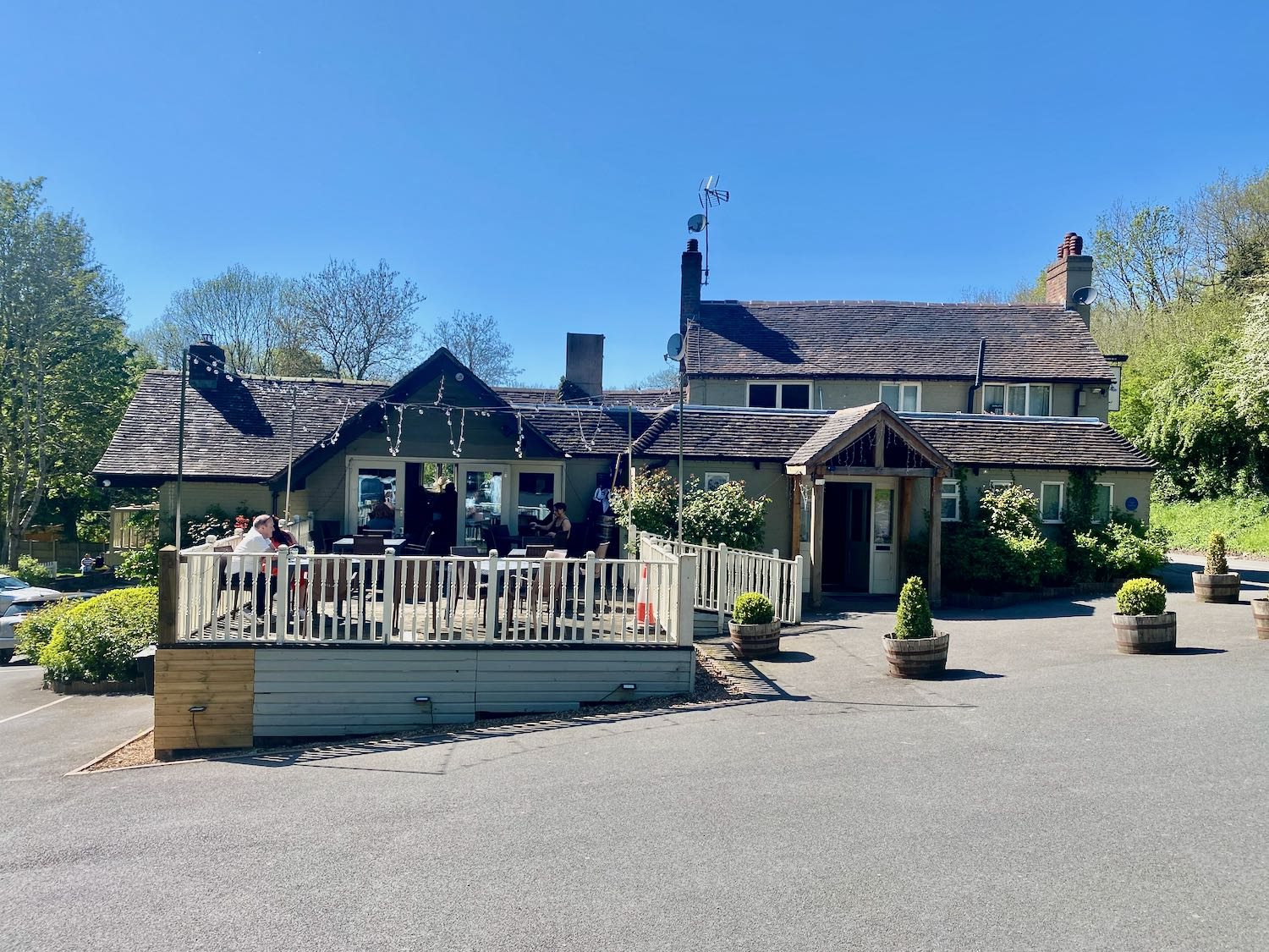 The Water Rat riverside pub at Ironbridge on a summer day, with picnic benches out front