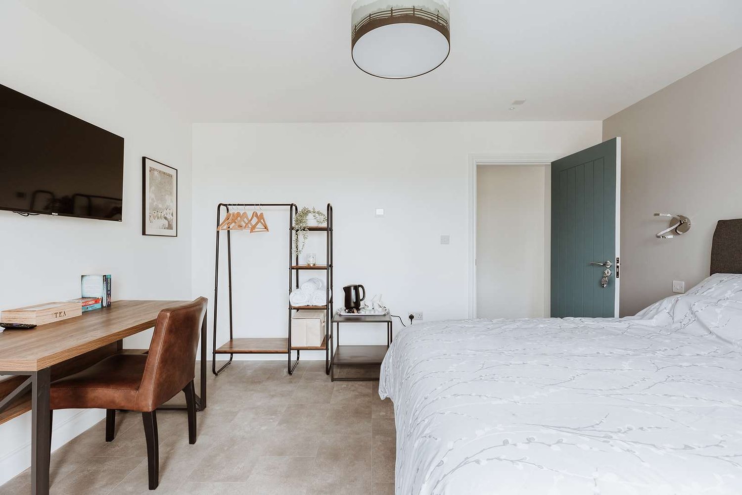 The Bridge Room at The Woodlands, with a desk and teal accent door